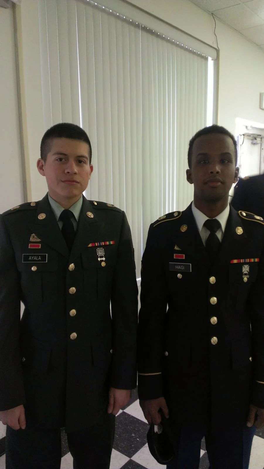Amilcar Ayala with a fellow soldier in dress uniform.