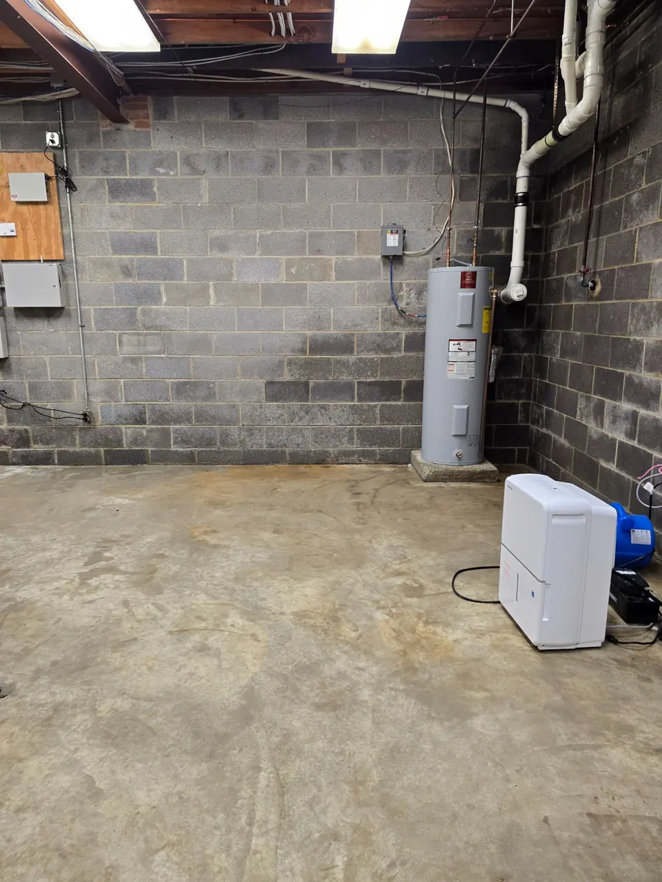 Utility-room floor from a second angle after cleaning.