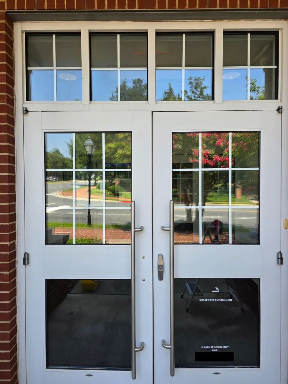 Clean glass entrance doors at a commercial property.