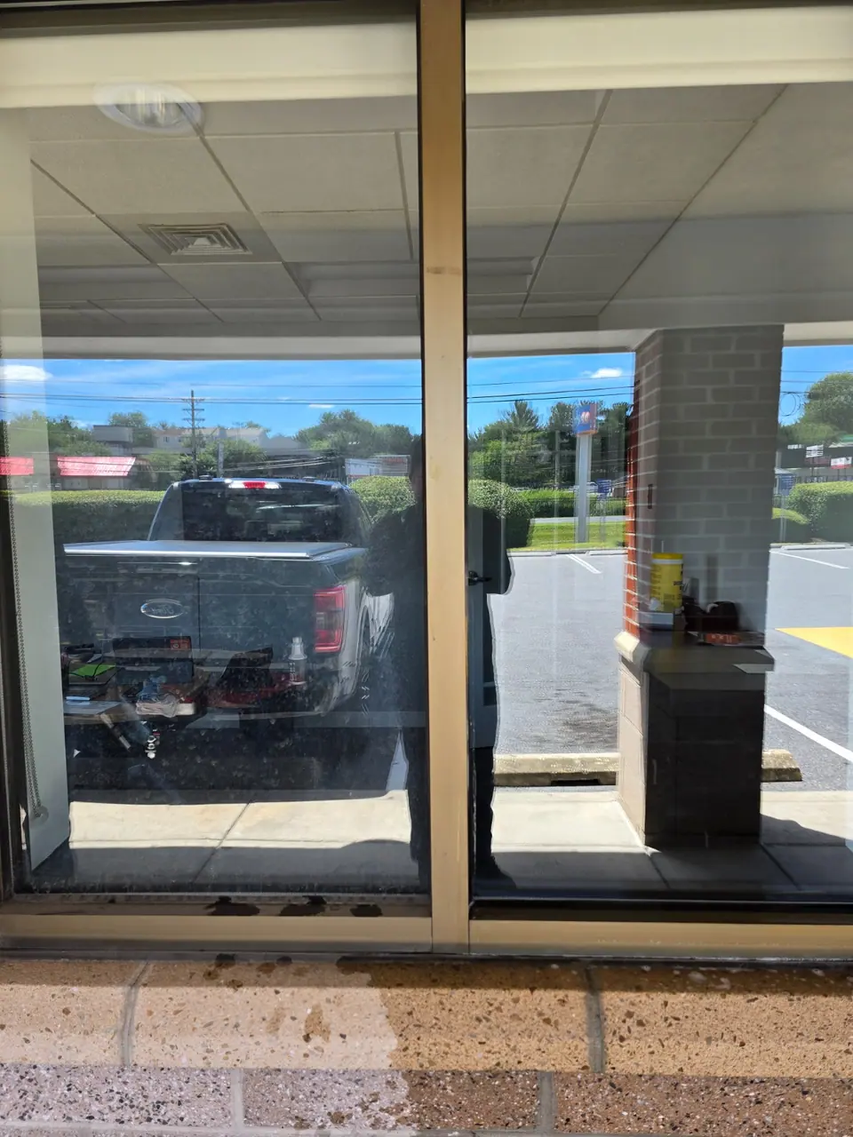 Window-cleaning comparison with the left pane dirty and the right pane clean.